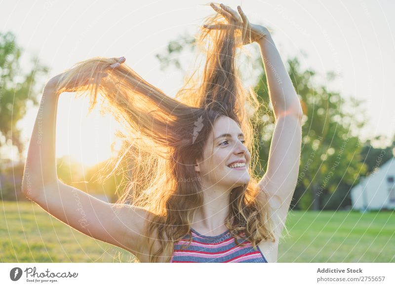 Girl posing in sunlight playing with hair Woman Playful Park Hair Posture Freedom Summer Playing Youth (Young adults) Joy Nature Happiness Beauty Photography