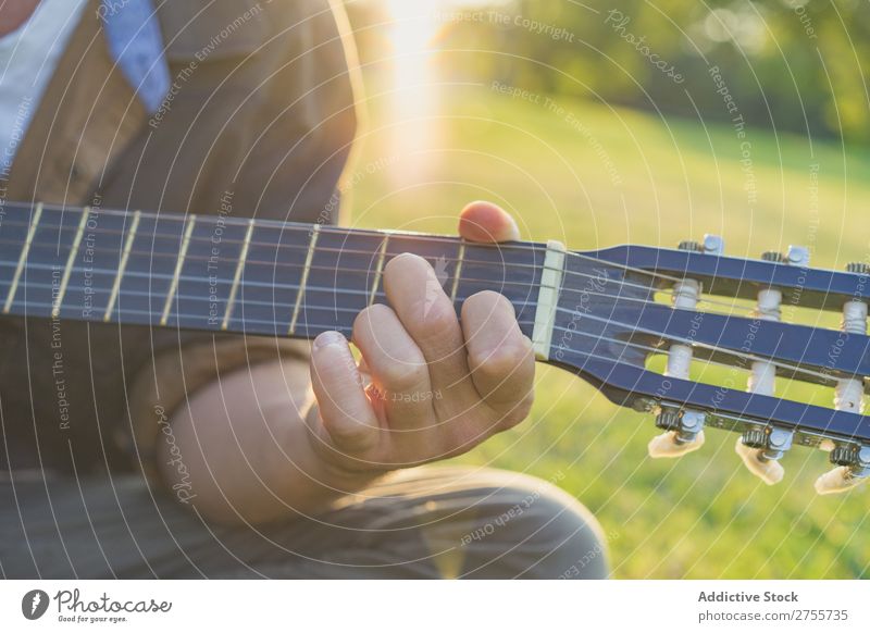 Crop man playing guitar on nature Man Park Guitar Summer Playing Landscape Hipster Musician Dream Nature Lifestyle romantic Vacation & Travel singing Easygoing