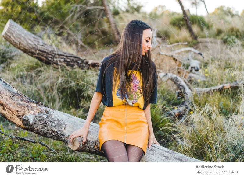 Pensive woman sitting on trunk in nature Woman pretty Nature Beautiful Portrait photograph Youth (Young adults) Beauty Photography Model Attractive Fashion