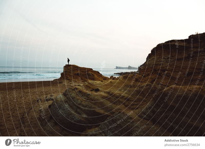 Unrecognizable man on coastal cliff Man Tourist Cliff Ocean Rock Vacation & Travel Tourism Nature Landscape Coast Water Sun Freedom Stone Natural Lifestyle