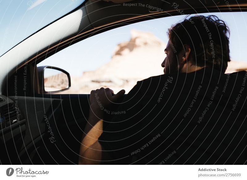 Man looking out car window Desert Window Street Vacation & Travel Lifestyle Human being Adults Camera Nature Adventure Trip Tourist Car Vehicle Landscape