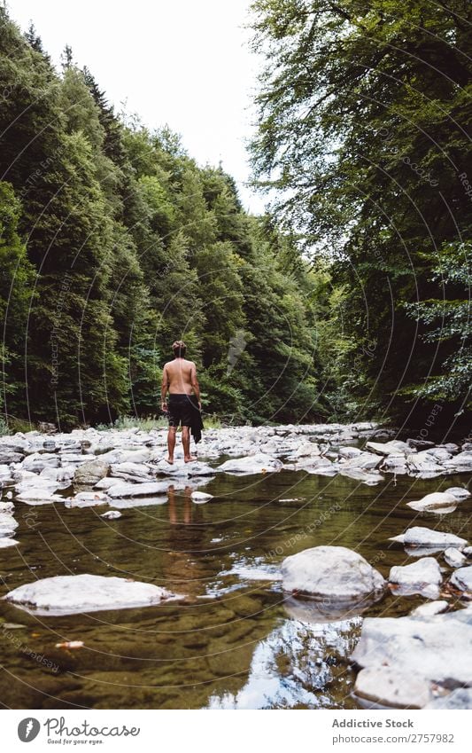 Man standing in a river Tourist Hiking River Pond Vacation & Travel Nature Adventure Trip Human being Lifestyle Tourism Leisure and hobbies trekking Action