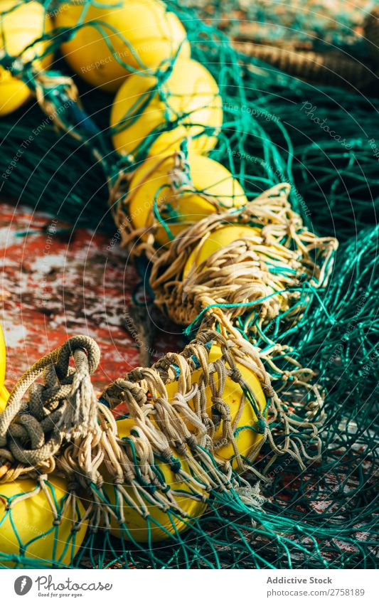 Net with yellow floats Ball bobber Buoy Colour Multicoloured Day Detail Equipment Fishery fishnet Float in the water Green Horizontal Industrial Industry marine