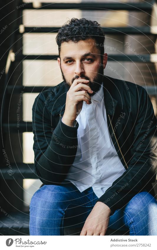 Thoughtful man sitting on stairs Man Style Pensive Considerate Looking into the camera Sit Stairs Self-confident Youth (Young adults) Cool (slang) Human being