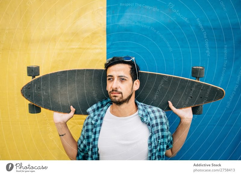 Bearded man holding skateboard Man Skateboard Youth (Young adults) Background picture Sports skateboarder Skateboarding Ice-skates Lifestyle Town Board Modern
