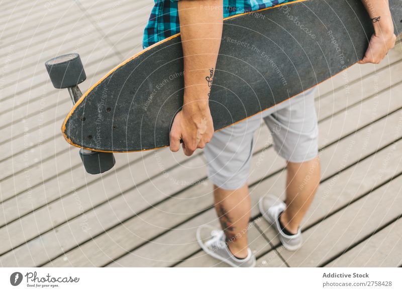 Closeup of man holding a longboard Skateboard Coast Beach Man Leisure and hobbies Summer Multicoloured youngster Action Youth (Young adults) Sports Ice-skates
