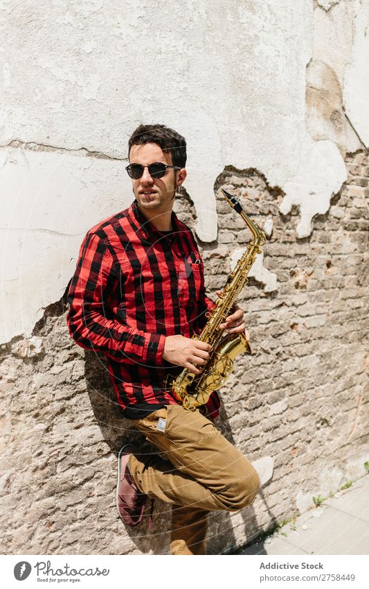 Cool musician with saxophone Musician Man Sunglasses Self-confident Cool (slang) Wall (building) Youth (Young adults) Jazz Saxophone instrument Musical