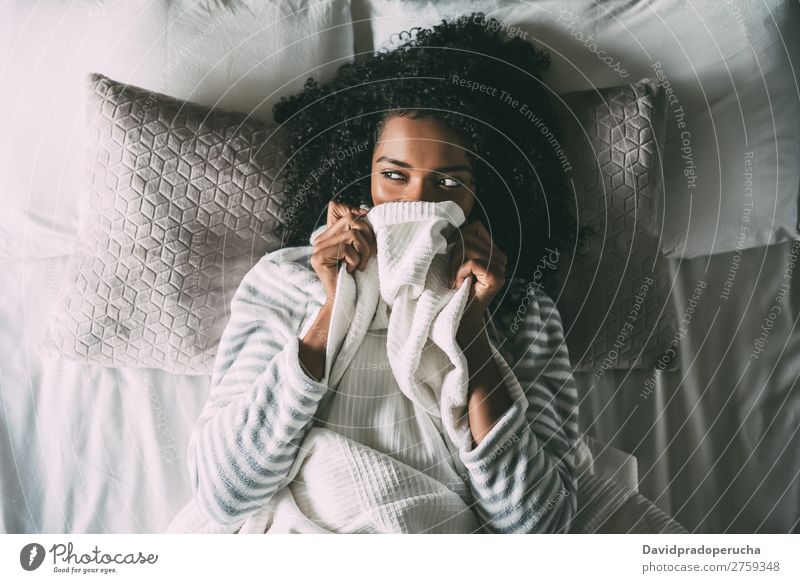 Pretty black woman covering her mouth with the sheet looking away Woman Bed Black Sheet Covering African Crops pretty Beautiful Bird's-eye view Close-up