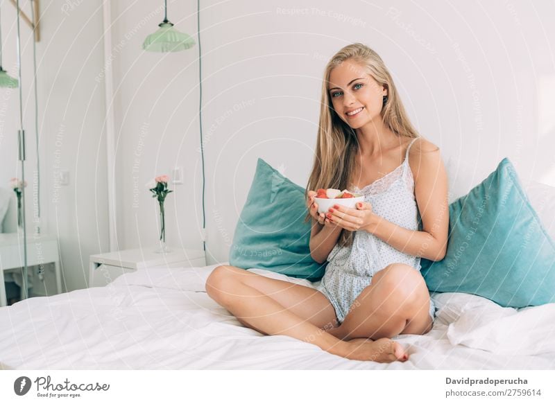 Young healthy beautiful blonde woman in the bed eating fruits Woman Bed Bedroom Blonde Portrait photograph Fruit Food To feed Smiling Youth (Young adults) Girl