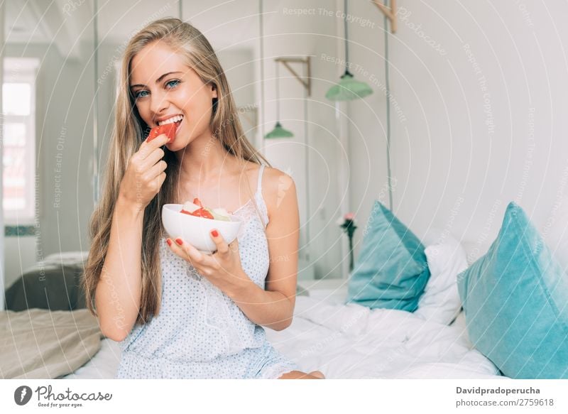 Young healthy beautiful blonde woman in the bed eating fruits Woman Bed Bedroom Blonde Portrait photograph Fruit Food To feed Smiling Youth (Young adults) Girl