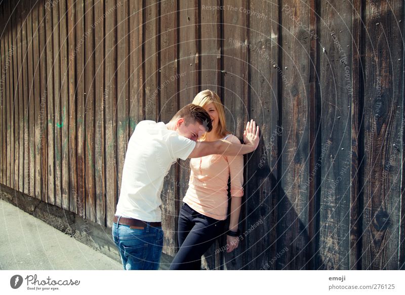 2 Masculine Feminine Young woman Youth (Young adults) Young man Friendship Couple Human being 18 - 30 years Adults Beautiful Laughter Facade Wall (building)