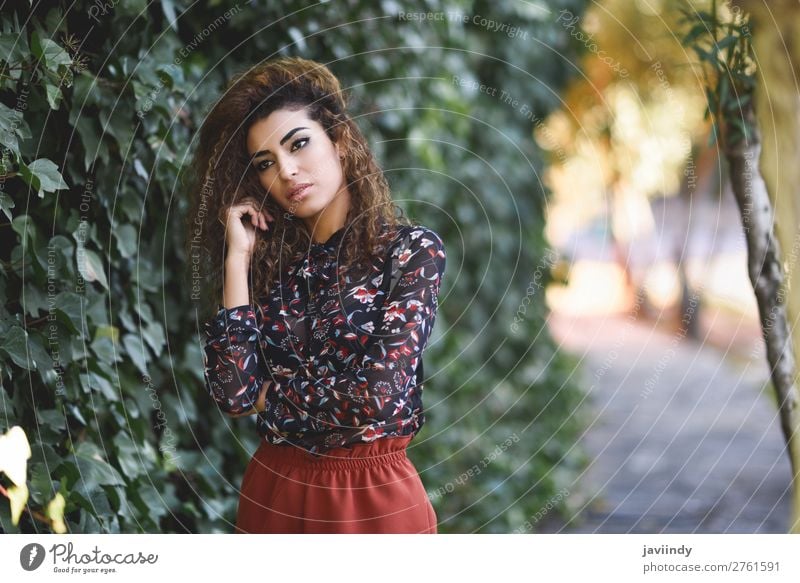 Arab girl in casual clothes in the street stock photo (185252) -  YouWorkForThem