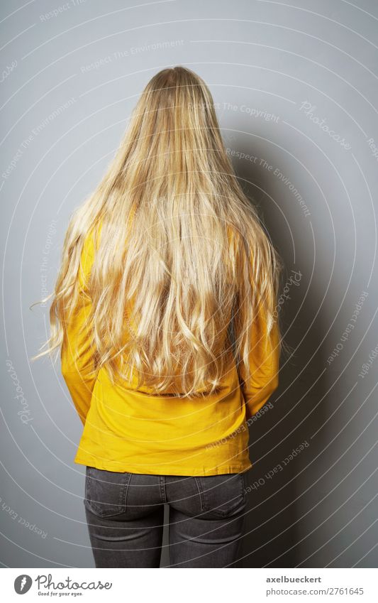 Woman with long blond hair from behind Human being Feminine Young woman Youth (Young adults) Adults 1 13 - 18 years 18 - 30 years Wall (barrier) Wall (building)