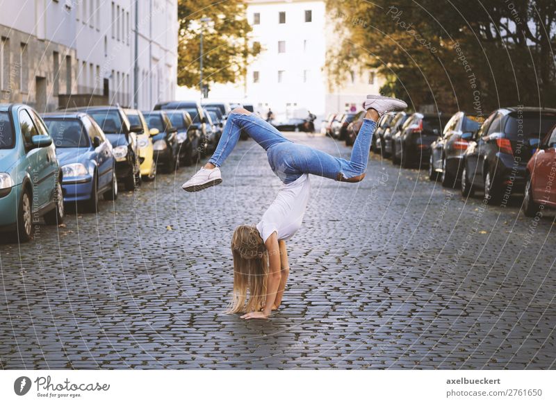 young woman doing handstand in the middle of the street Lifestyle Joy Athletic Leisure and hobbies Sports Fitness Sports Training Yoga Human being Feminine Girl