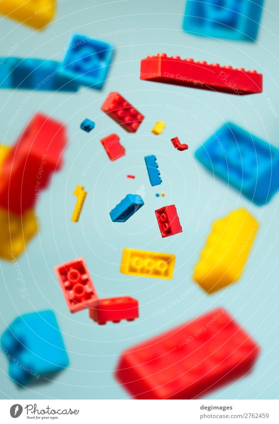 Floating Plastic geometric cubes in the air. Construction toys Design Playing Child Infancy Toys Brick Build Movement Blue Colour blocks falling background rows