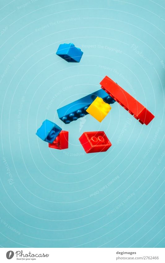 Floating Plastic geometric cubes in the air. Construction toys Design Playing Child Infancy Toys Brick Build Movement Blue Colour blocks falling background rows