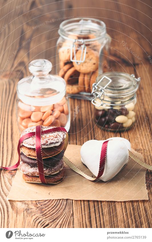 Gingerbread cookies, candies, cakes in jars on wooden table Cake Dessert Candy Nutrition Eating Diet Lifestyle Table Heart To enjoy Delicious Brown Baking