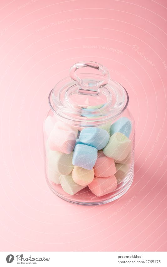 Jar filled with colorful marshmallows on plain background Dessert Candy Nutrition Eating Diet Bright Delicious Blue Colour eat food isolated jar pastel Plain