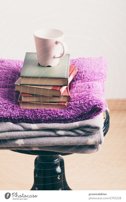 A few books with cup of coffee and blanket on wooden chair Coffee Mug Lifestyle Relaxation Leisure and hobbies Reading Chair Book Warmth To enjoy Brown