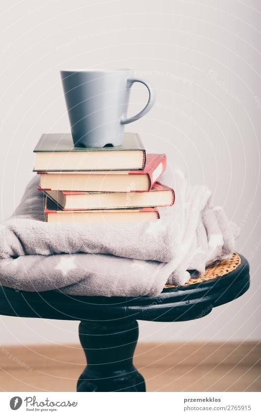 A few books with cup of coffee and blanket on wooden chair Coffee Mug Lifestyle Relaxation Leisure and hobbies Reading Chair Book To enjoy Safety (feeling of)