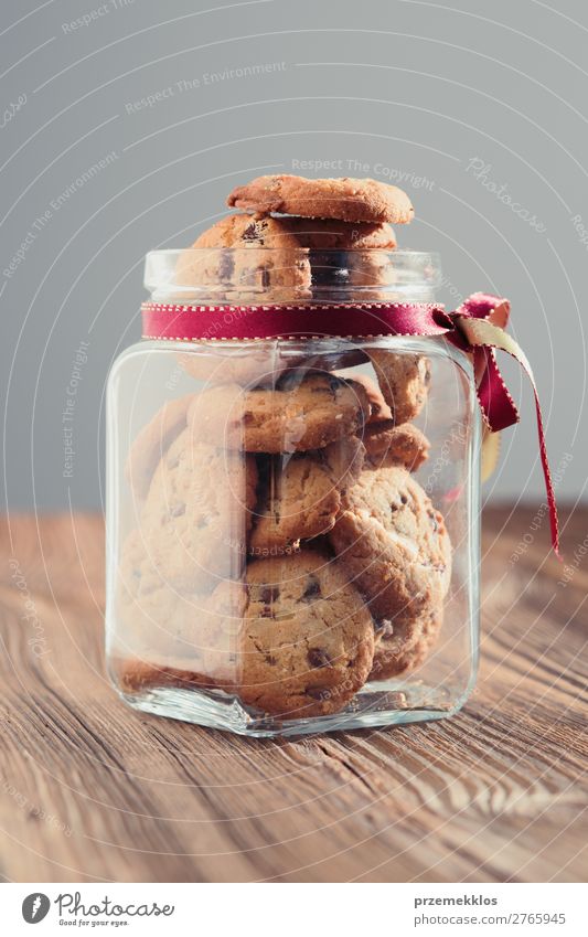 Big jar filled with oat cookies standing on a wooden table Cake Dessert Nutrition Eating Diet Lifestyle Table Delicious Brown Baking Bakery biscuit chocolate