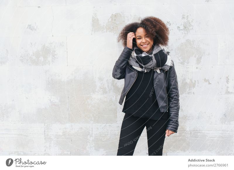Smiling woman in leather jacket Woman Concrete Wall (building) Youth (Young adults) Attractive Human being Fashion Style Design Easygoing Blank Wear Clothing