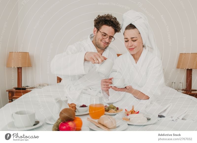 Couple having breakfast in hotel Eating Breakfast Together Room service Bathrobe Hotel Bedroom Home Interior design Furniture Flat (apartment) Design