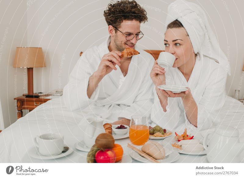 Couple having breakfast in hotel Eating Breakfast Together Room service Bathrobe Hotel Bedroom Home Interior design Furniture Flat (apartment) Design