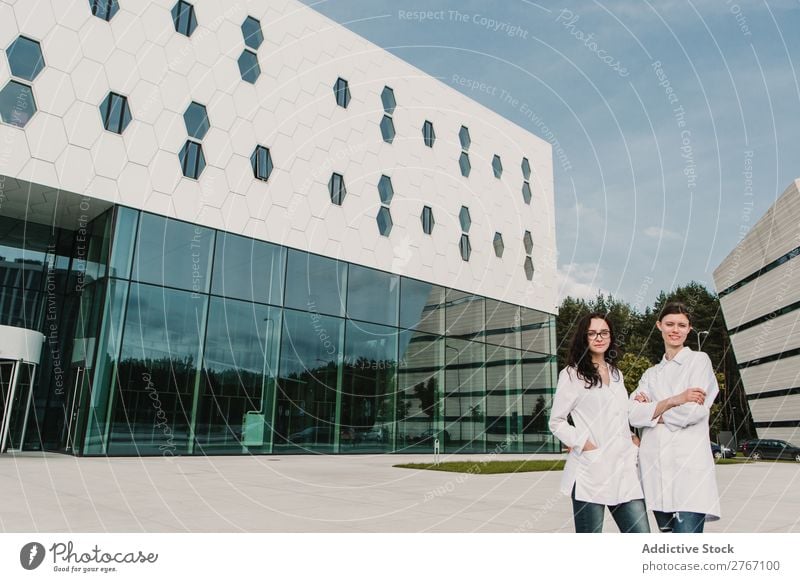 Women in whites at modern building Laboratory Work and employment Science & Research Woman Building Modern Contemporary Human being Scientist Medication