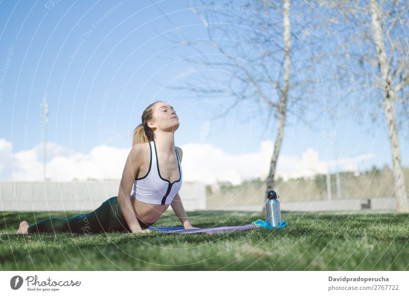 woman doing yoga and pilates outdoor with her mat Lifestyle Beautiful Body Relaxation Meditation Sports Yoga Human being Woman Adults Nature Warmth Park