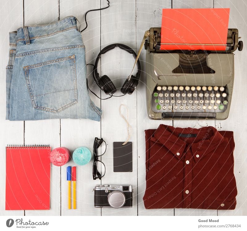typewriter, notepad, clothes, headphones, camera and glasses Shopping Vacation & Travel Trip Table Blackboard Camera Clothing Pants Jeans Accessory Pack Pen