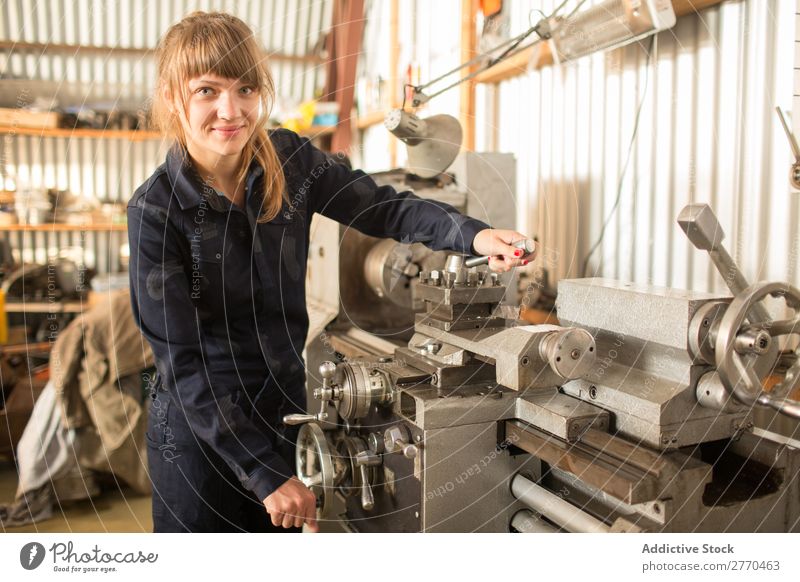 Woman posing with machinery Hangar Machinery Equipment occupation Stand Industry Mechanical Engineer Success Employees &amp; Colleagues Engineering Clothing