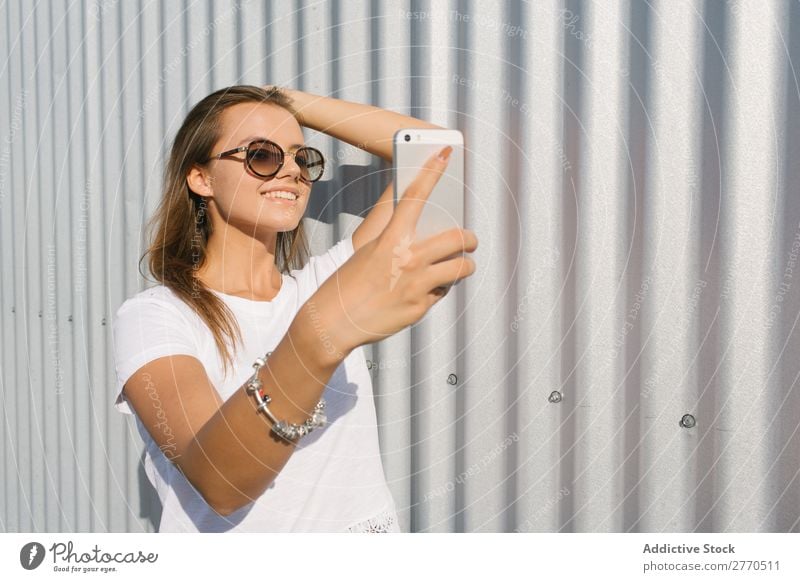 Youngster taking selfie at street Woman Town PDA Relaxation Self-confident Style Posture Summer Street Technology Leisure and hobbies youngster Connection