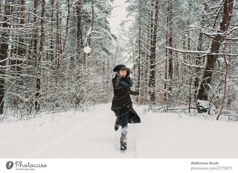 Cheerful woman having fun in winter forest Woman Forest Winter Snow Cold Nature Youth (Young adults) Joy Street Lanes & trails White Beautiful Happy Seasons
