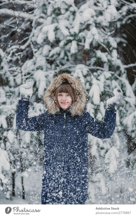 Woman throwing up snow in forest Forest Winter Snow Cold Nature Youth (Young adults) Snowfall White Beautiful Happy Seasons Joy Lifestyle Leisure and hobbies