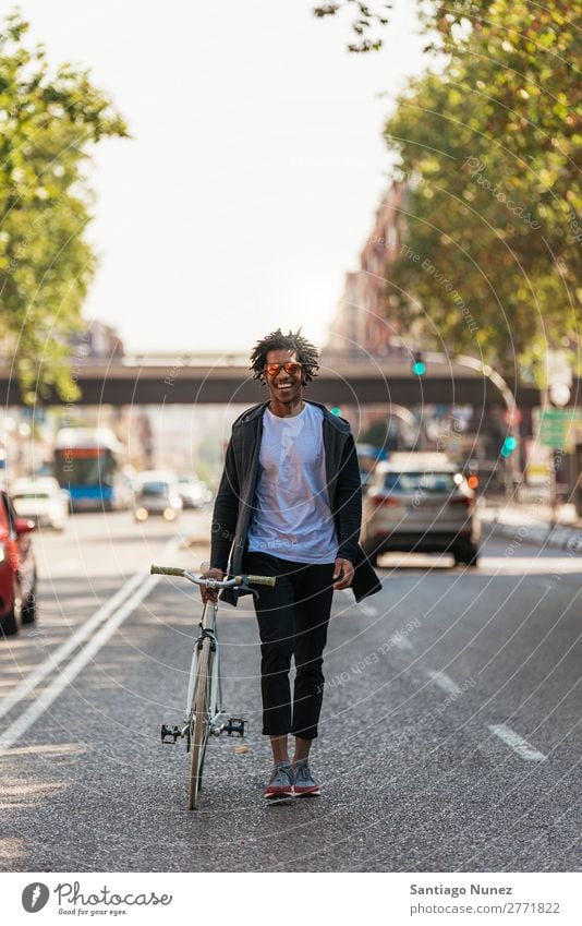 Handsome afro man walking with his bike. Man Youth (Young adults) Afro Black mulatto African Bicycle fixie Hipster Lifestyle Cycling City Town Human being
