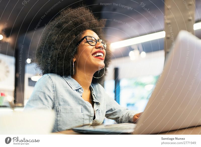 African Black Business Woman Using Smartphone While Working Laptop Office  Stock Photo by ©ridofranz 598023862