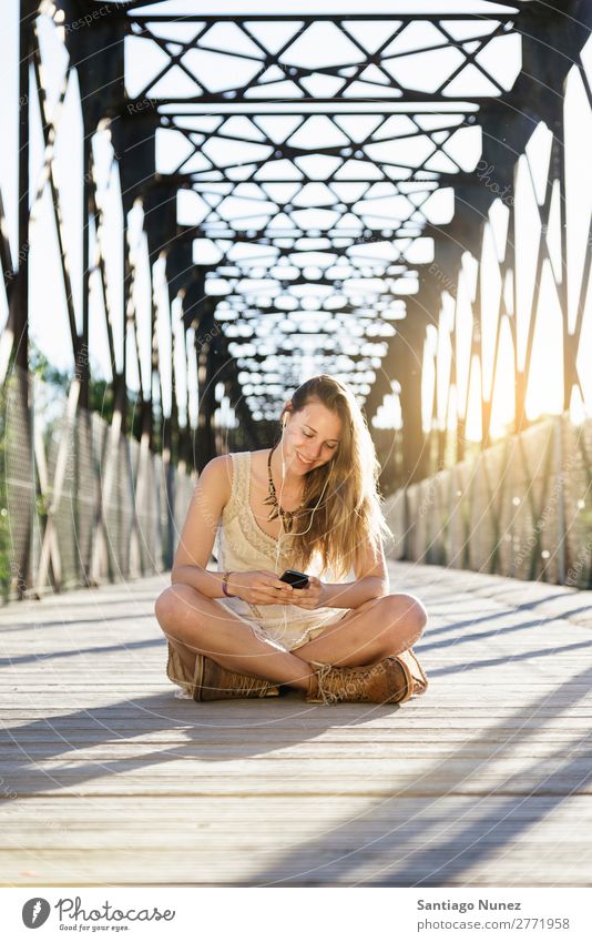 Beautiful young woman using mobile. Telephone Mobile Woman PDA Youth (Young adults) Girl Happy user Solar cell texting Human being Exterior shot Autumn Hair Joy