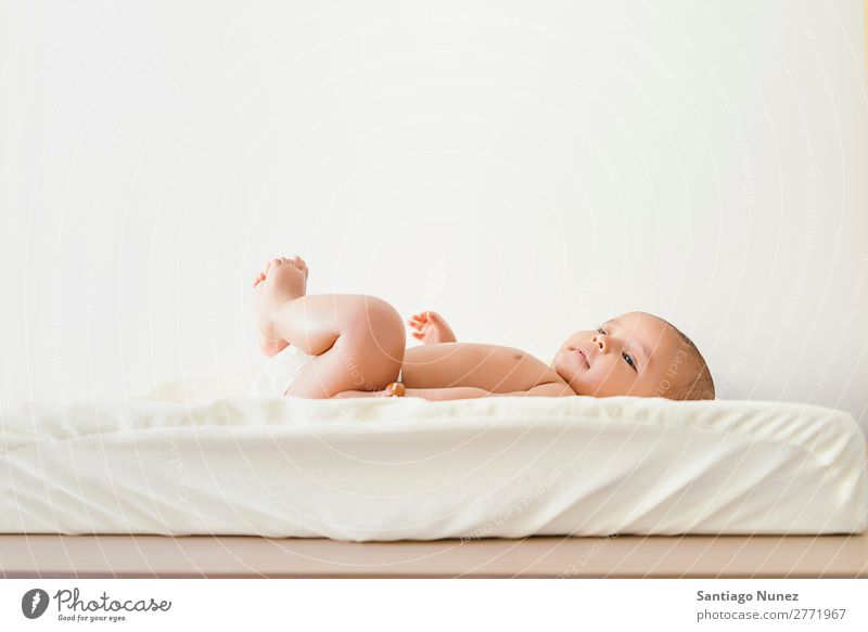 Cute Baby Girl Lying in the Baby Changer. Boy (child) Child baby changer Lie (Untruth) Newborn Beautiful Portrait photograph Human being Caucasian Face Eyes