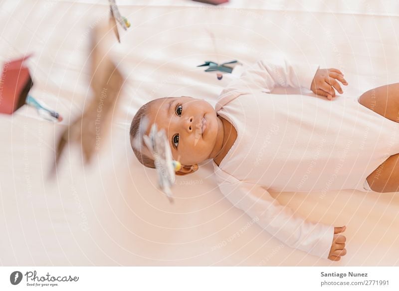 Cute Baby Girl Lying In The Crib A Royalty Free Stock Photo From