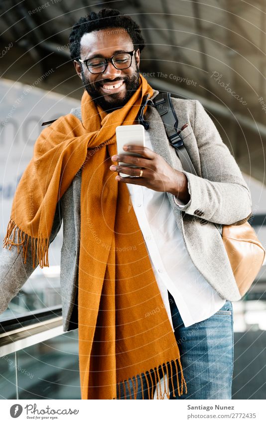 Businessman in the Train Station. Man Black African American Cellphone Youth (Young adults) Telephone Happy Mobile Interior shot Street PDA Office Human being