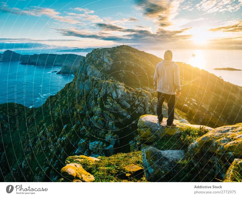 Traveler posing on amazing landscape Man traveler Panorama (Format) Ocean Rock Mountain Sunlight Virgin forest Dream Nature exploration Perspective Picturesque
