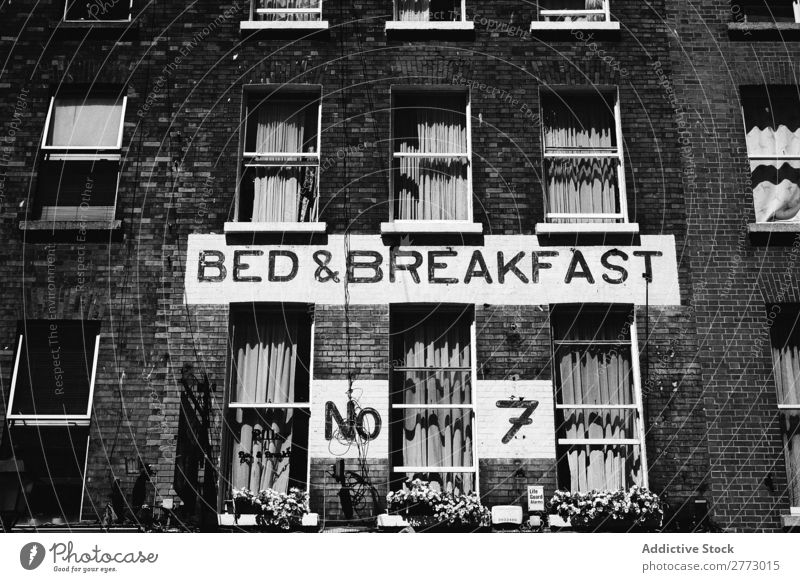 A house with sign on a wall House (Residential Structure) Sign Wall (building) Brick Bed Breakfast Black & white photo Symbols and metaphors Old Deserted