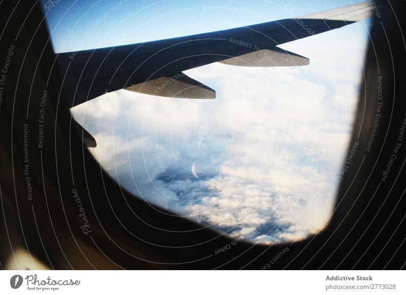 Wing of plane in the air Airplane illuminator Story Porthole Window Height Sky aerospace Earth Vantage point Fly Vacation & Travel Jet Engines Transport Blue