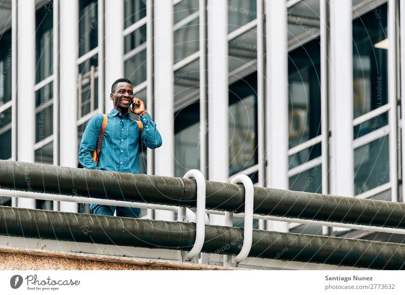 Businessman in the Street. Man Black African American Cellphone Youth (Young adults) Telephone Happy Mobile Exterior shot PDA Office Human being Communication