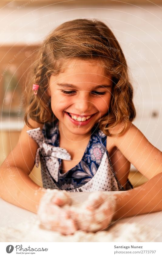 Little child girl kneading dough prepare for baking cookies. Child Girl Cook Cooking Kitchen Flour Chocolate Daughter Day Happy Joy Family & Relations Love