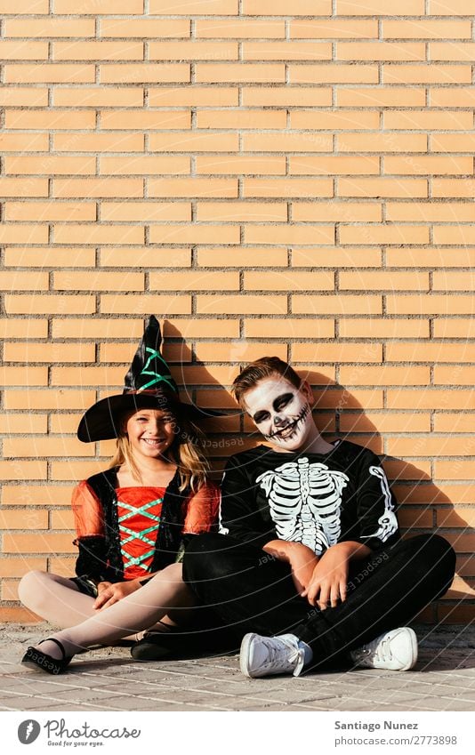 Portrait of children disguised in the street. Hallowe'en Child Girl Boy (child) Painting (action, artwork) Skeleton Witch Joy Family & Relations Sister