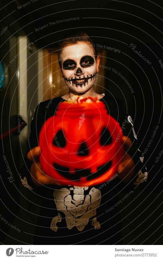 Portrait of boy disguised of skeleton saying trick or treating. Hallowe'en Child Boy (child) Painting (action, artwork) Skeleton Joy Family & Relations Brother
