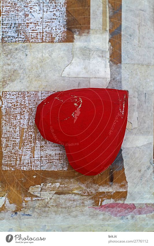Red heart of wood with style lies as a still life, upside down on an old graphic, trashy white art background of wood, paint and paper. Feasts & Celebrations
