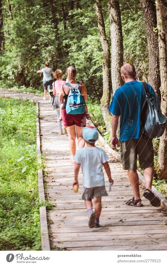 Family going a path in forest Lifestyle Vacation & Travel Trip Summer Child Boy (child) Woman Adults Man Parents Mother Father Family & Relations Infancy Nature